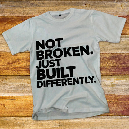 Not Broken. Just Built Differently. T-Shirt