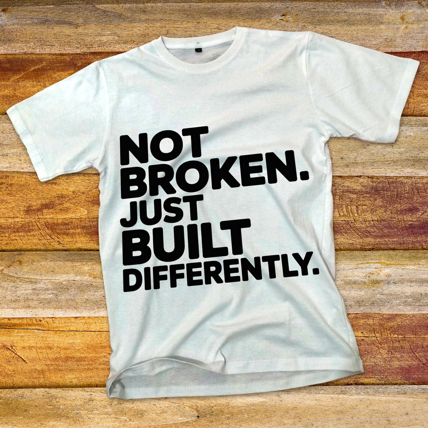 Not Broken. Just Built Differently. T-Shirt